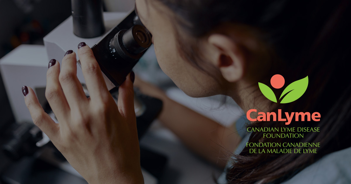 Close up of a researcher looking through a powerful microscope in a lab doing research, with the CanLyme logo floating on the right hand side.