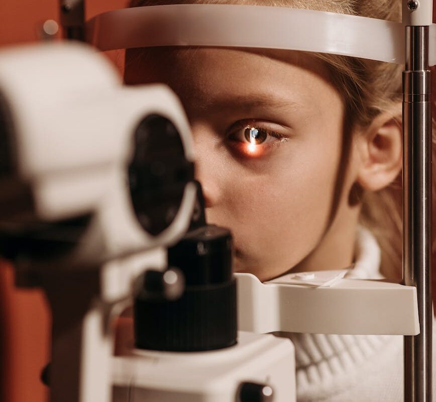closeup of a girl with an ophthalmological equipment