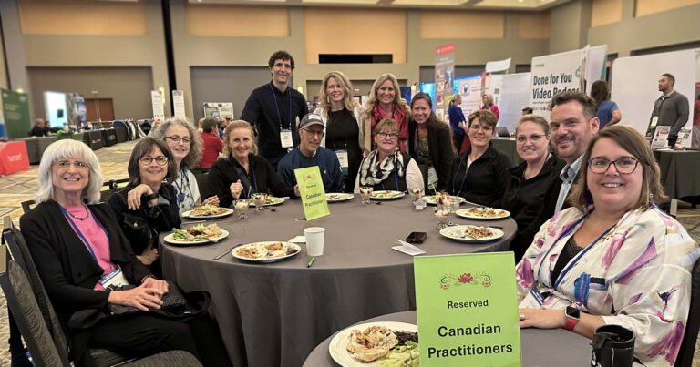 Dr. Sarah Keating and other Canadian health care practitioners sit together at ILADS 25.
