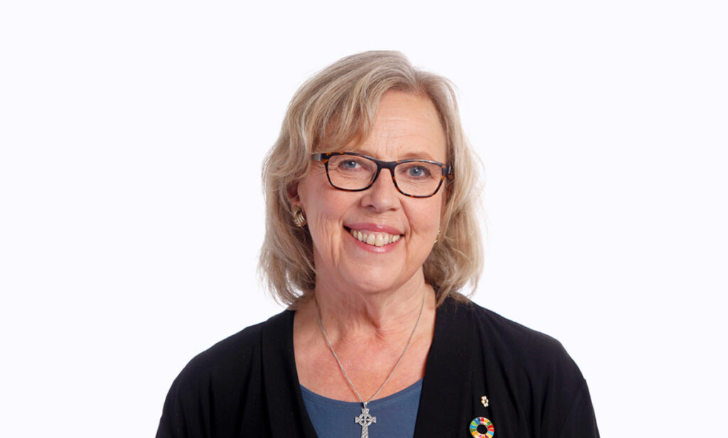 Elizabeth May smiles warmly.