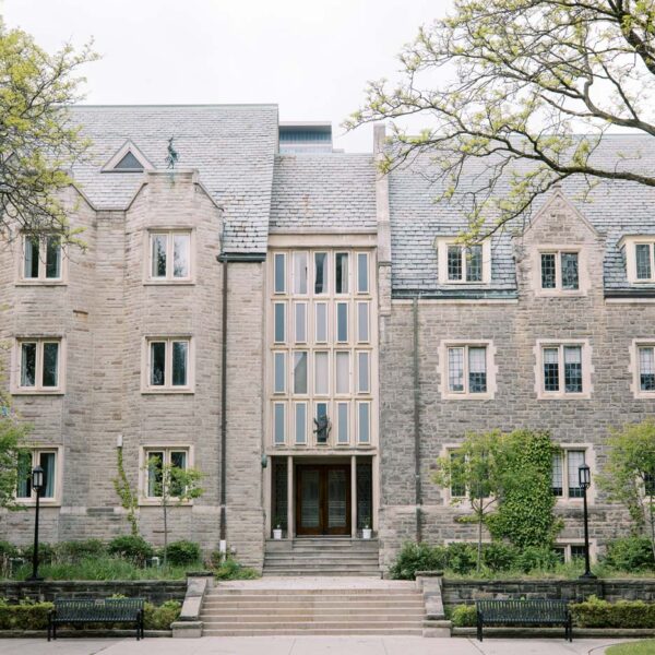A brick building at the University of Toronto stands solidly in the fall.