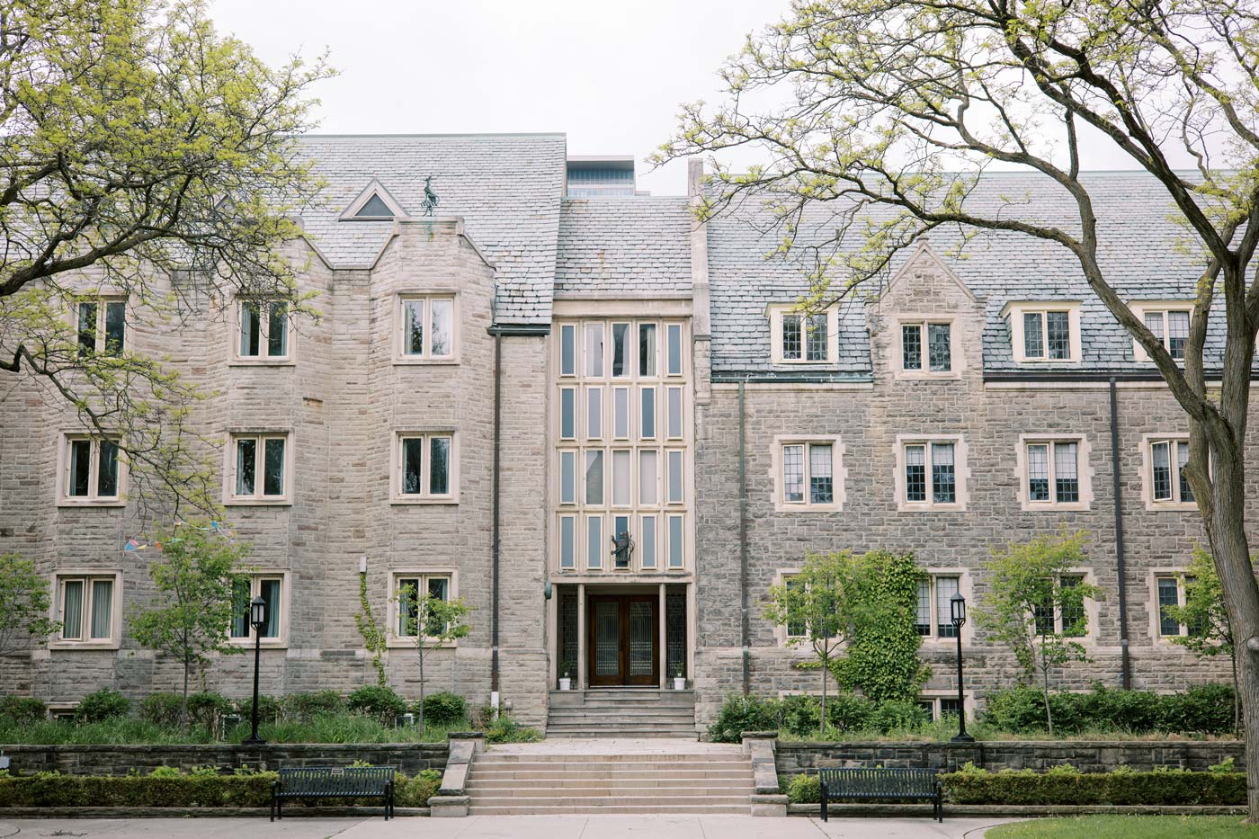 A brick building at the University of Toronto stands solidly in the fall.